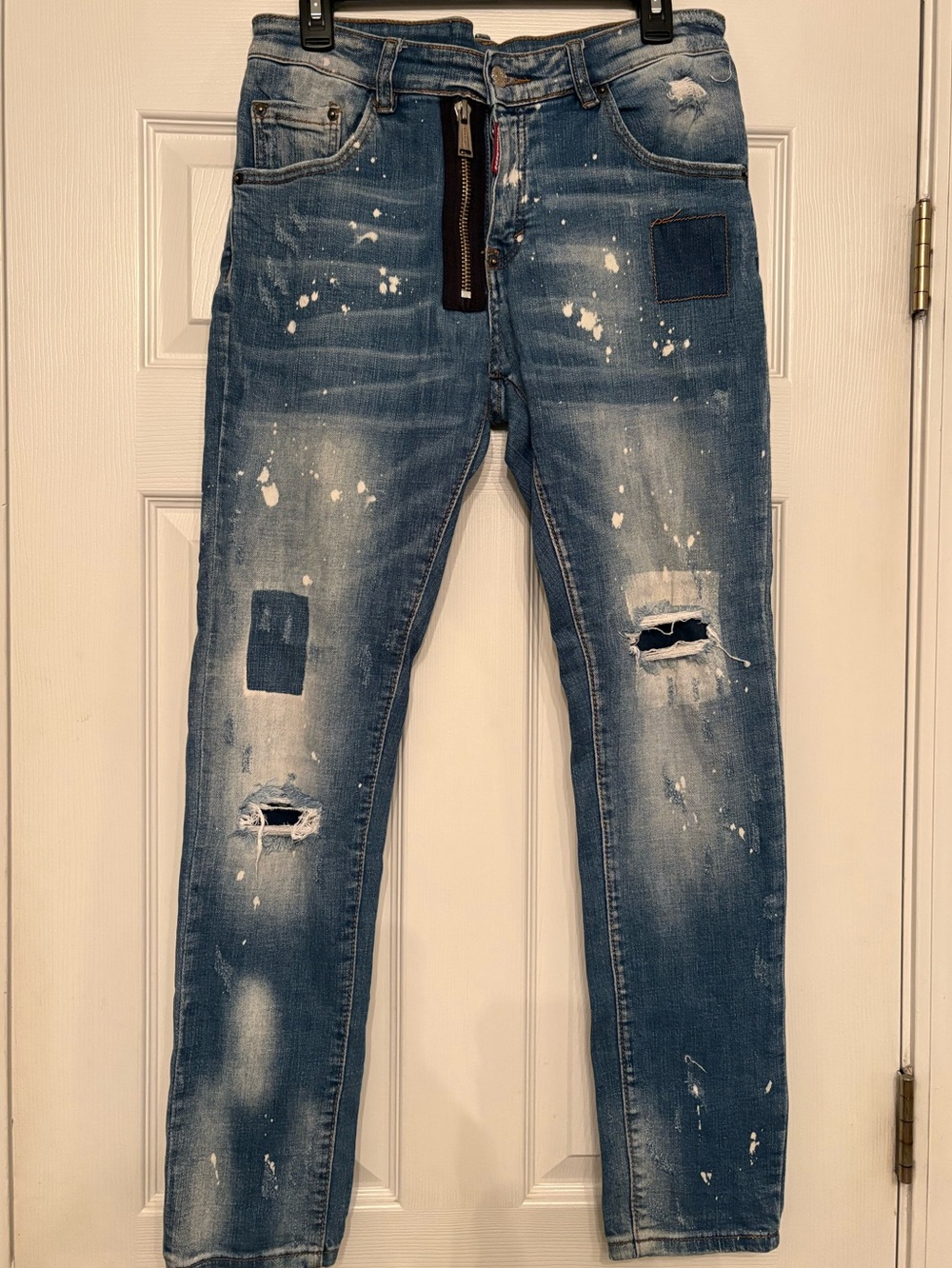 DSQUARED2 Slim Distressed Jeans in Blue with White Paint Accents. Italian sizing